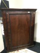 A Victorian mahogany hanging corner cabinet