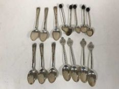 A set of four silver teaspoons, another set of six and a set of five coffee spoons, 4.