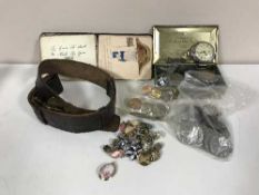 A basket of assorted coins, costume jewellery, church Lads Brigade belt, pocket watches, pen knives,