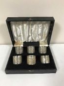 Six boxed silver napkin rings