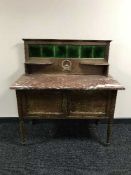 A late Victorian oak marble topped tiled washstand