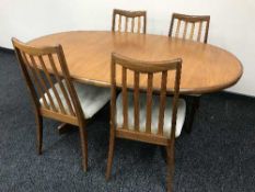 A teak G Plan extending table and four chairs
