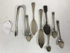A group of silver including a pair of Georgian sugar tongs, 5.