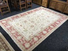 A large cream fringed Ziegler rug