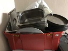 A tub of stainless steel bain marie pots,