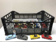 A box of un-boxed advertising vehicles and die cast sports cars