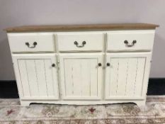 A painted pine triple door sideboard