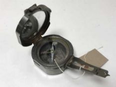 A metal pocket compass by Stanley