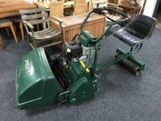 An Atco Royale 24E I-C petrol sit-on cylinder lawnmower, with tow-along seat and collection box.