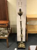 A heavy brass standard lamp