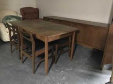 A six piece mid 20th century teak dining room suite