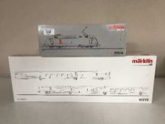 A Marklin 37374 diesel locomotive together with a 41773 Express Train Passenger Car Set (HO Scale),