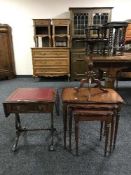 A nest of three tables, leather topped sofa table and a wine table.