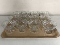 A tray of twelve lead crystal grapefruit dishes .