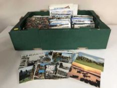 Two boxes of assorted postcards
