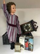 A crate of Perinzlux binoculars, projector, thirty-one day wall clock, carriage clock,