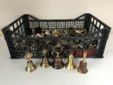 Two baskets of assorted of brass and metal bells - hand bells,