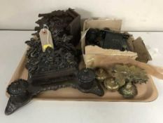 A tray of decorative metal desk stand, brass ink wells, door furniture,