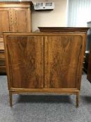 A walnut double door cabinet