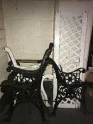 Four sets of cast iron bench ends and a bench back
