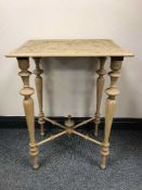 A heavily carved pine occasional table