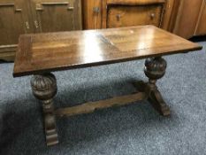 A carved oak refectory coffee table