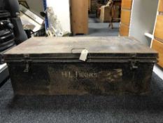 A metal trunk of table linen, quilt and a lady's hat box of hats.