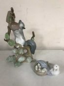 Two Lladro figures - squirrel and a swan with signets