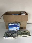 A box of model air craft modelling kits and vintage toys