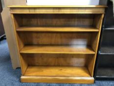 A set of yew wood open bookshelves