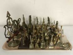 A collection of assorted of brass bells,