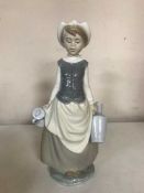 A Lladro figure of a milkmaid