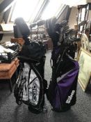 A Wilson and an Ogio golf bags of assorted Titlus,