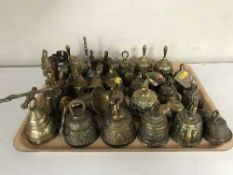 A collection of assorted of metal bells - religious etc