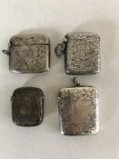 Four silver vesta cases