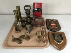 A tray of heavy brass candlesticks, brass weights, hip flasks, wall plaques,