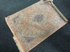 A Tabriz design rug on peach ground