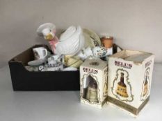A box of china, commemorative mugs, Ringtons teapot,