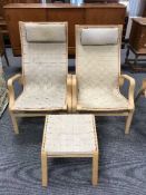 A pair of beech framed chairs in webbing fabric with headrests and a stool
