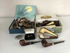 A cigar box containing a quantity of pipes, cheroot holder, coins etc,