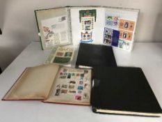 A collection of four stamp albums of stamps,