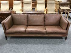 A late 20th century brown leather settee
