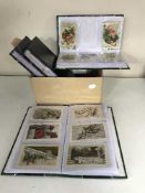 Four albums of greetings post cards