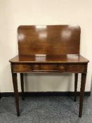 A 19th century mahogany tea table,