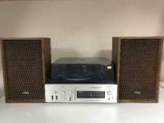 An Onkyo turn table amplifier with speakers together with a box of lps and 45's