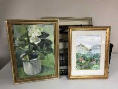 A box of framed prints,