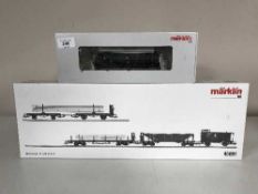 A Marklin 39441 diesel locomotive together with a 46091 freight car set (HO Scale),