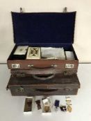 Three leather cases of Freemason's medals, books, regalia etc.