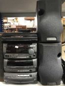 A Kenwood hi/fi system with speakers and remote