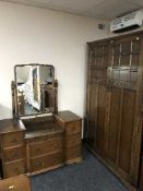An oak double door wardrobe and dressing chest